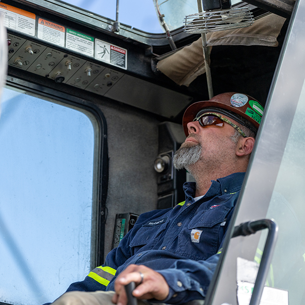 Crane Operator focused on maneuvering crane on a jobsite