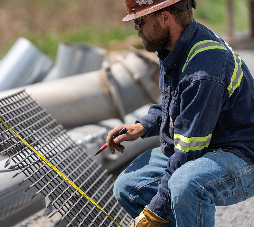 Millwright measuring steel grate