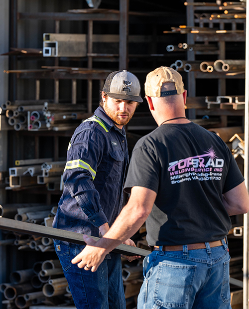 Top Bead metalworkers selecting a metal piece for a project